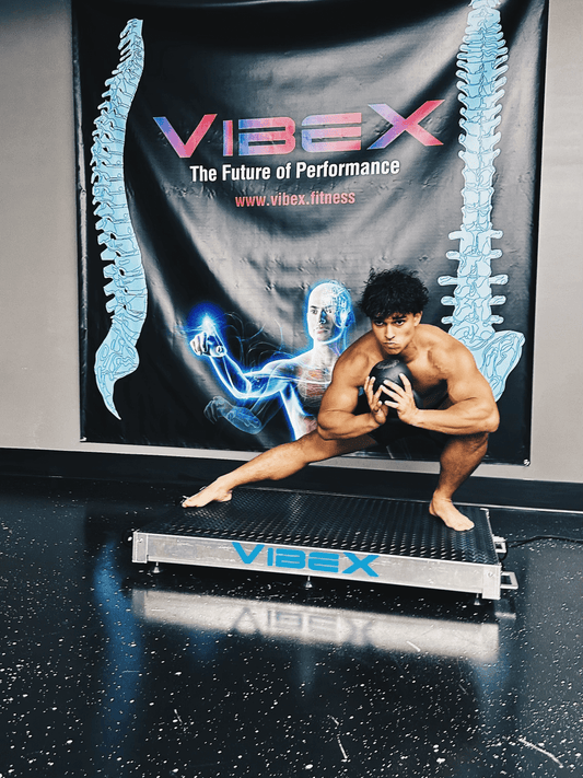 Young athlete exercising on Vibe-X Plate with banner in the background